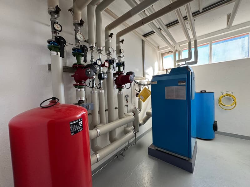 Heating system with pipes, valves, and tanks