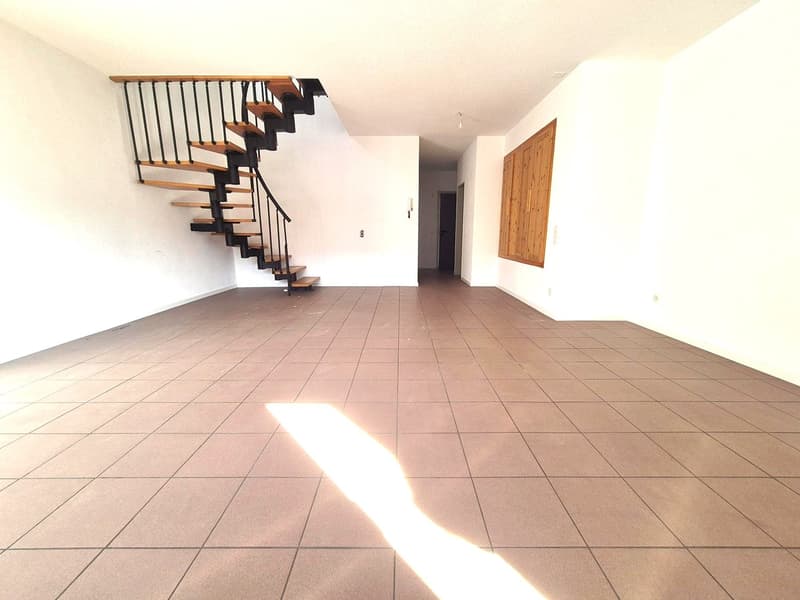 empty room, tiled floor, staircase, no furniture