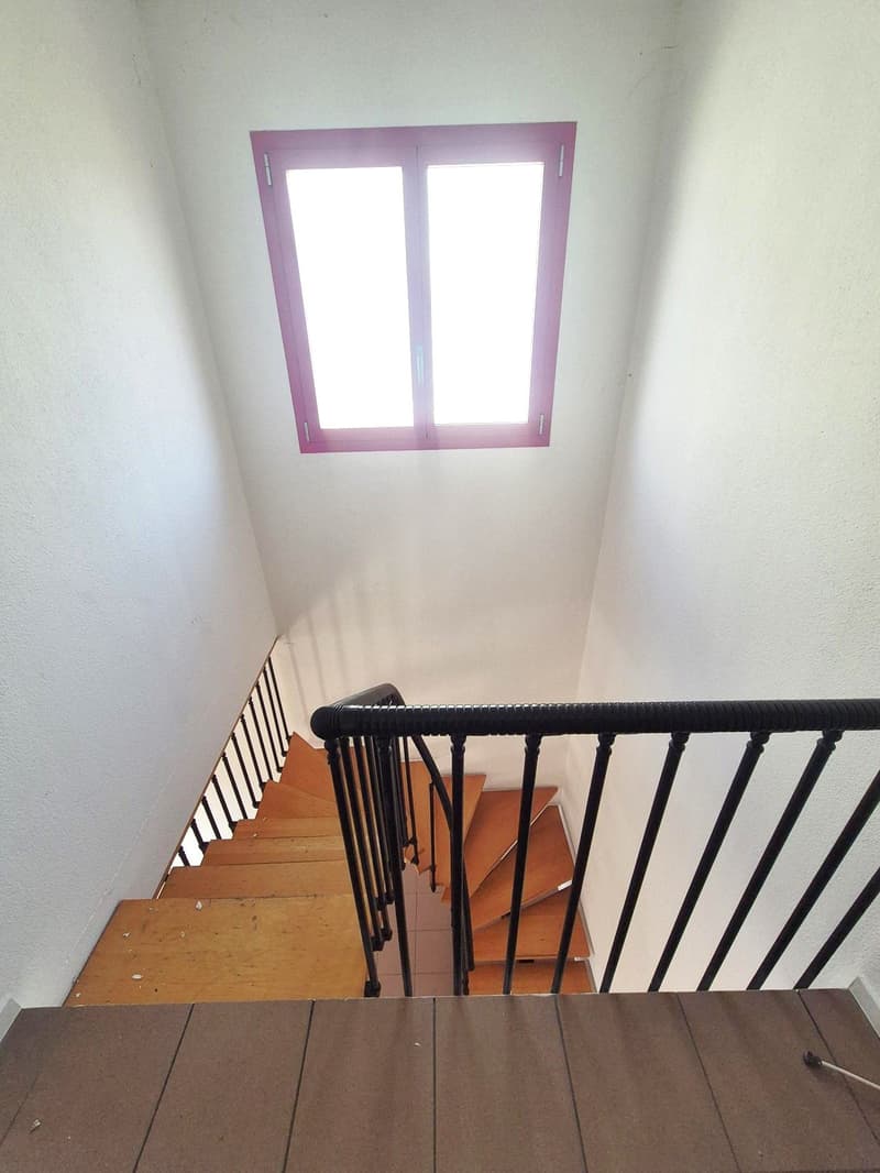 wooden steps, white walls, window