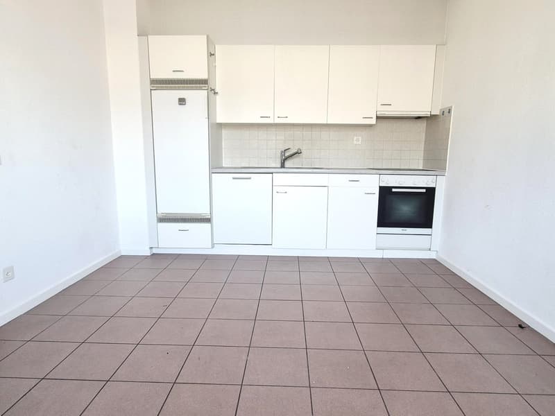 white cabinets, tiled floor, sink, built-in oven, refrigerator