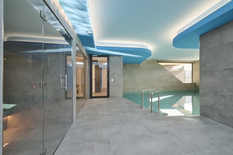 indoor swimming pool, modern design, grey tiles, blue ceiling