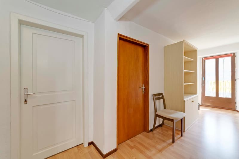 white door, wooden door, chair, cupboard, window