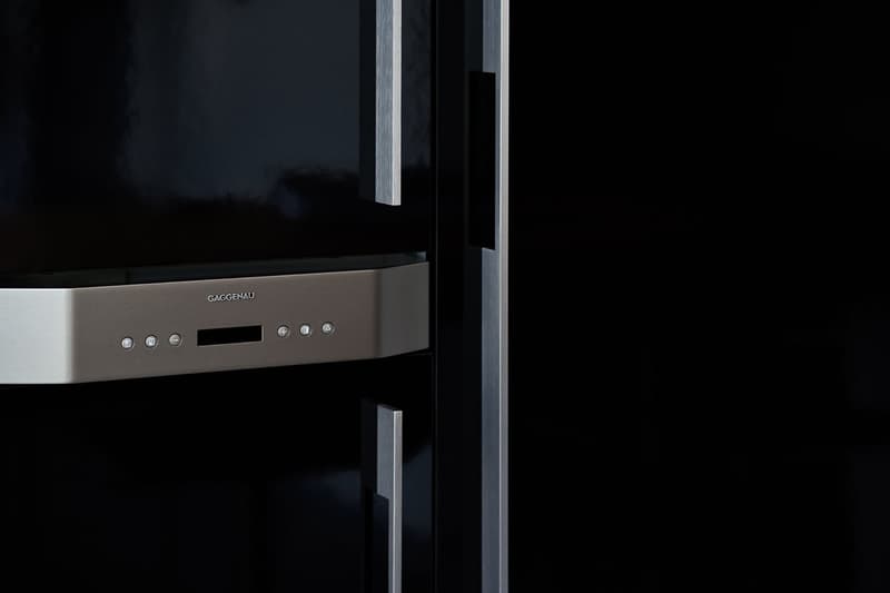 Black fridge with silver control panel, silver handles, black interior
