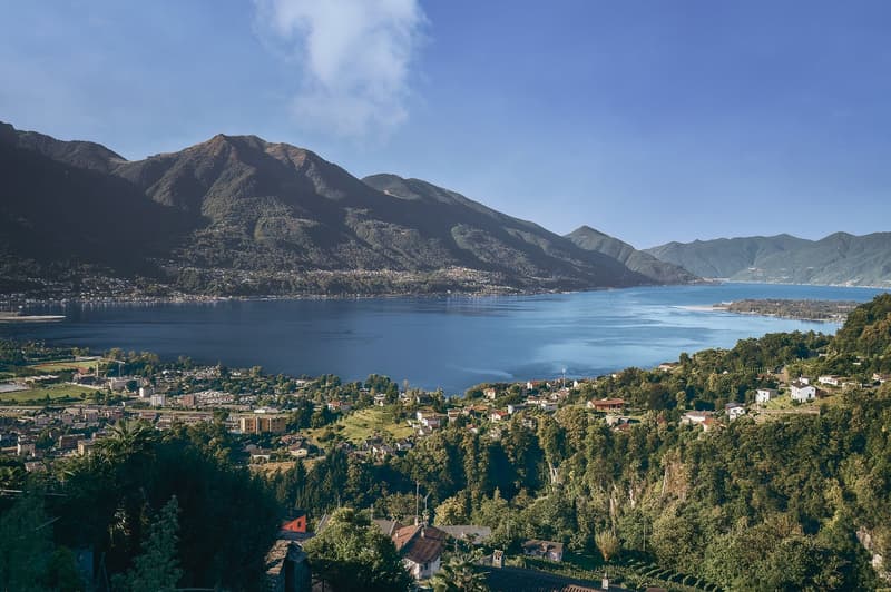 hillside overlooking lake and town