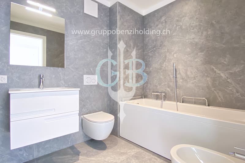 modern white bathroom, bathtub, shower, toilet, vanity with mirror