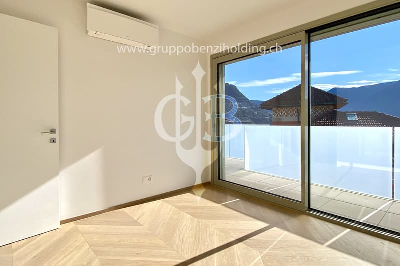 sliding doors, balcony, hardwood floors, white walls, outdoor view