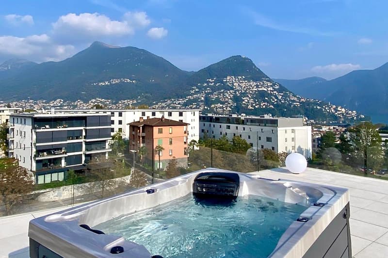 swimming pool on rooftop, building background, mountainous view