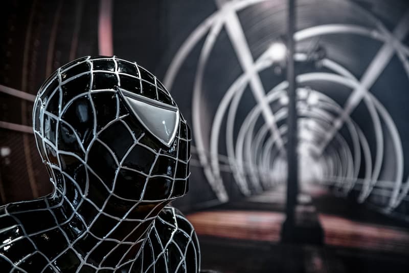 Modern building, Black spider man statue, arch bridge