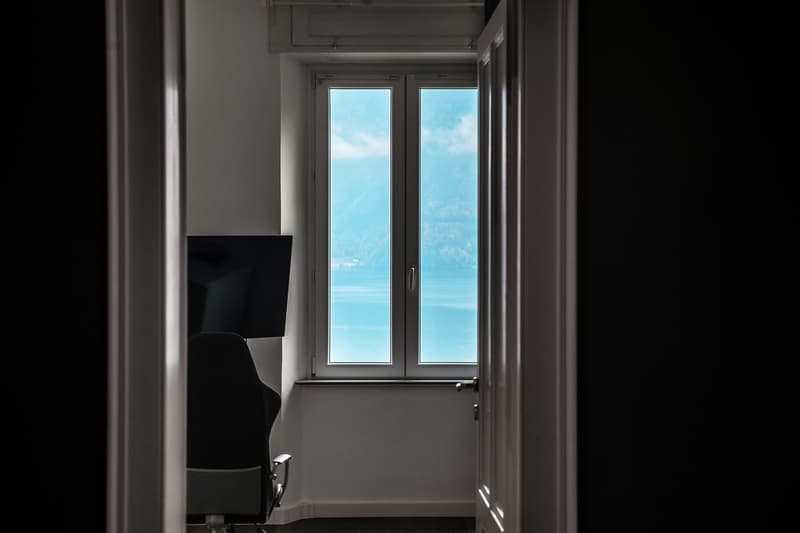 minimalist room, desk, chair, window with sea view
