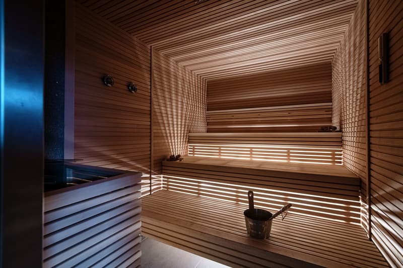 wood paneling, double bench seating, bucket with ladle, tiled floor