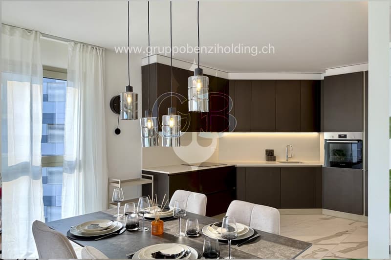 modern dining room, white chairs, table, kitchen with modern cabinets, gas stove, oven, sink, window, decorative light fixtures