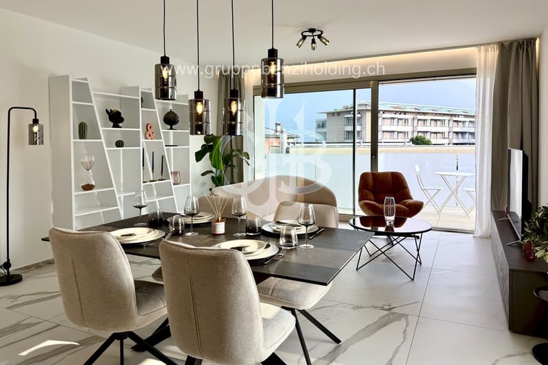 open plan dining room with sliding door to balcony