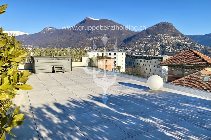 tiled floor, storage box, bench, large white sphere, lush green plants, panoramic view of the mountains