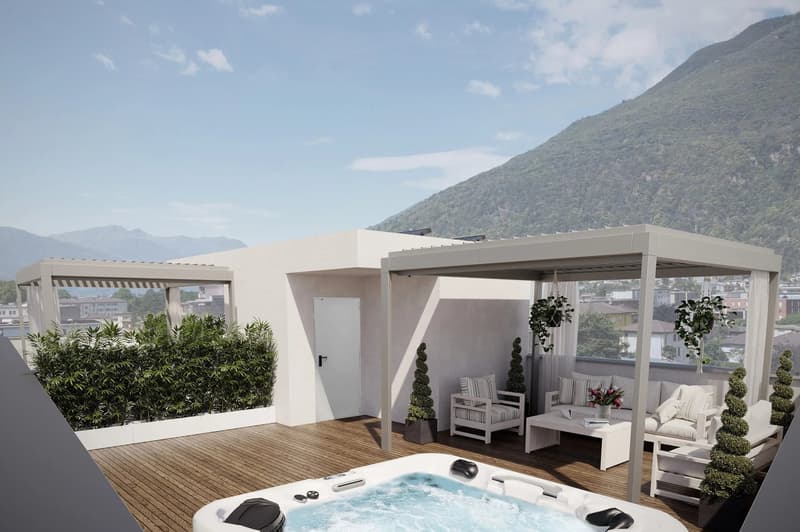 Spacious rooftop terrace with a hot tub, lounge area with comfortable seating, and a small garden with potted plants. The apartment appears to be on a raised ground floor with a modern, minimalist design and large windows offering scenic mountain views.