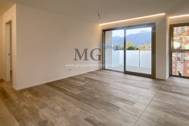empty room, large windows, balcony, wooden floors, white walls