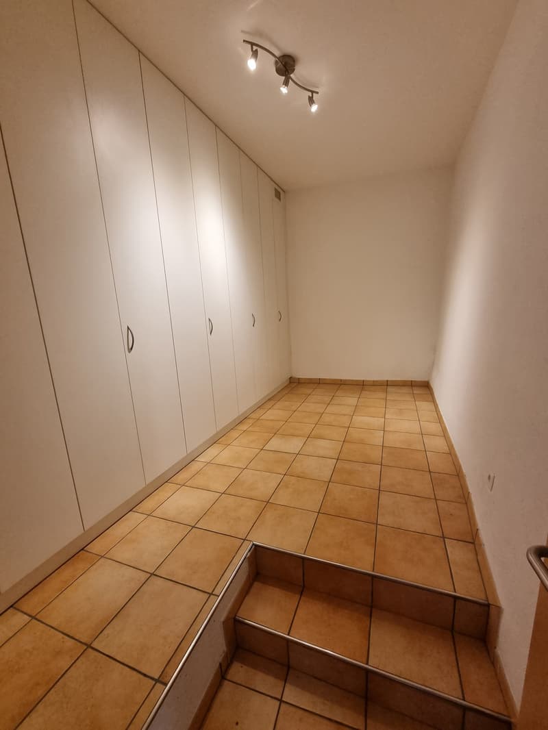 empty room with tiled floor and built-in wardrobes