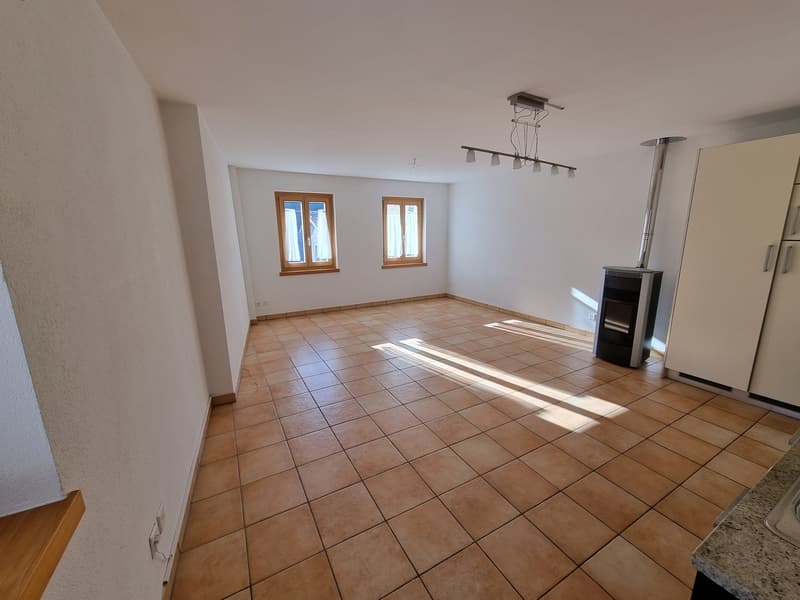 empty room with tiled floor, 2 windows, fireplace