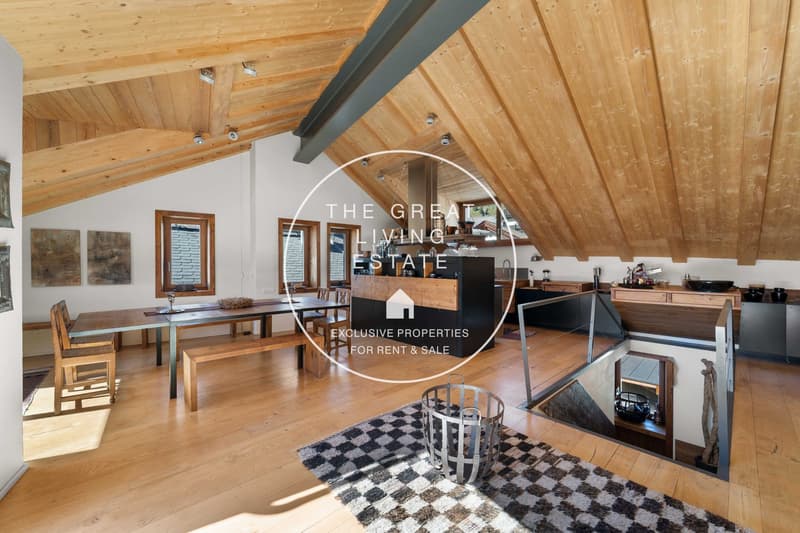 loft style dining room with large wooden table, modern kitchen, wooden beams, large windows