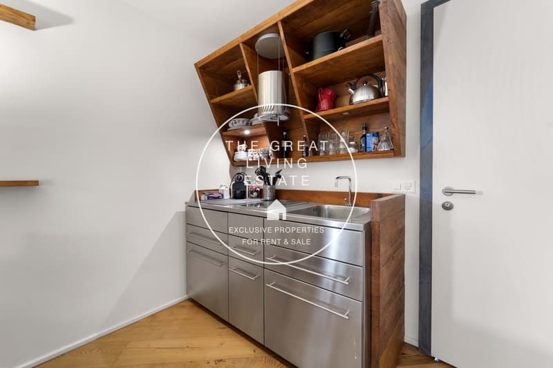 modern kitchen with a sink, gas stove, oven, kettles, teapots, cabinets and drawers