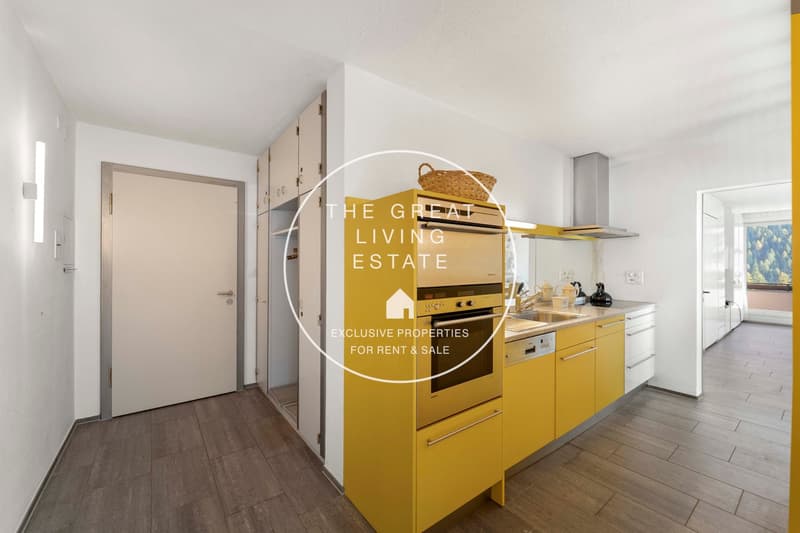 modern kitchen with yellow cabinets, dishwasher, oven, sink, countertop