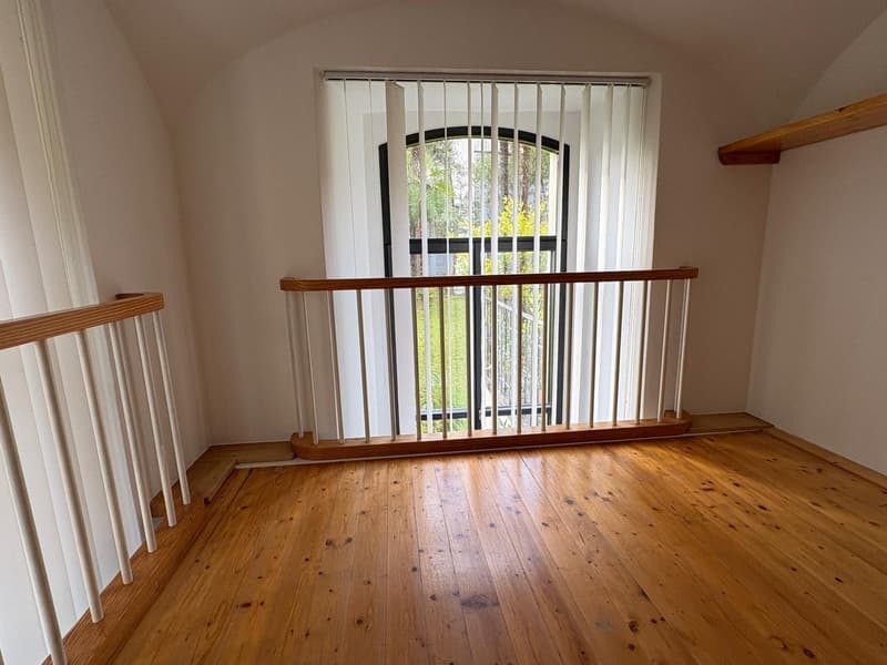 wooden floor, white walls, vertical blinds, staircase, window with railing
