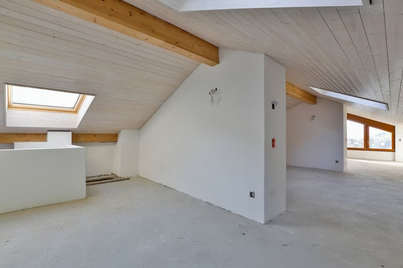 white ceiling, wooden beams, empty room, large windows, white walls, unfinished space, fire extinguisher