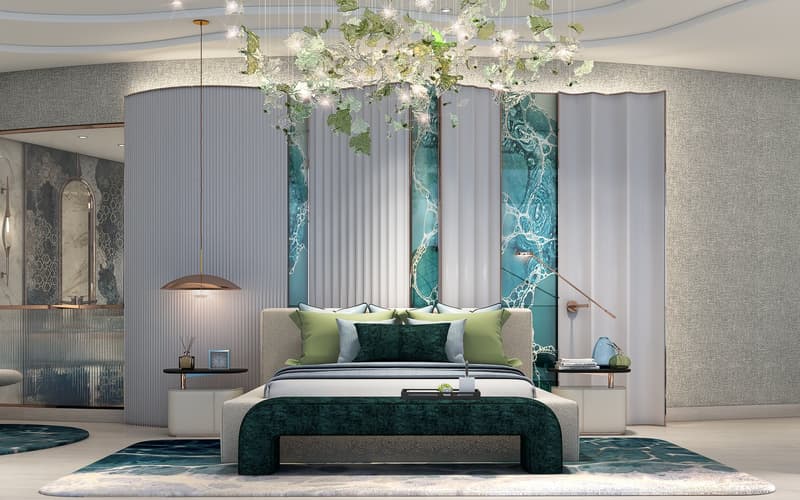 A modern bedroom with a bed, green and gray pillows, decorative items on bedside tables, a green rug, a chandelier, and a wall-mounted lamp.