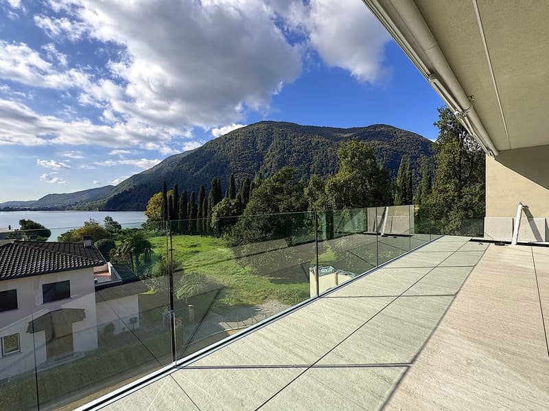 glass railing, tiled floor, stunning lake and mountain view