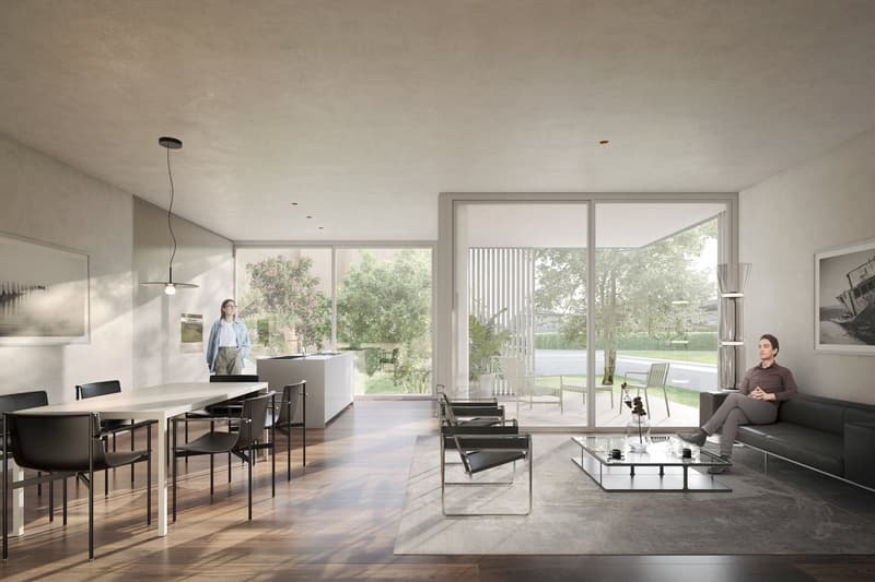 modern living room with large windows, wooden floor, white dining table, black chairs, glass coffee table, black couch, pendant light