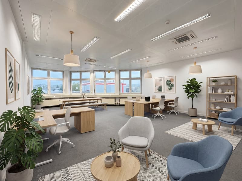 modern office space with desks, chairs, plants, and a wooden coffee table