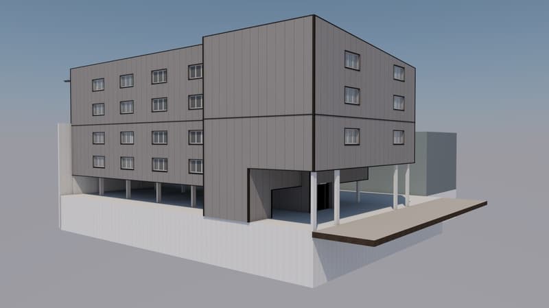 Three-story building, multiple windows, garage at base