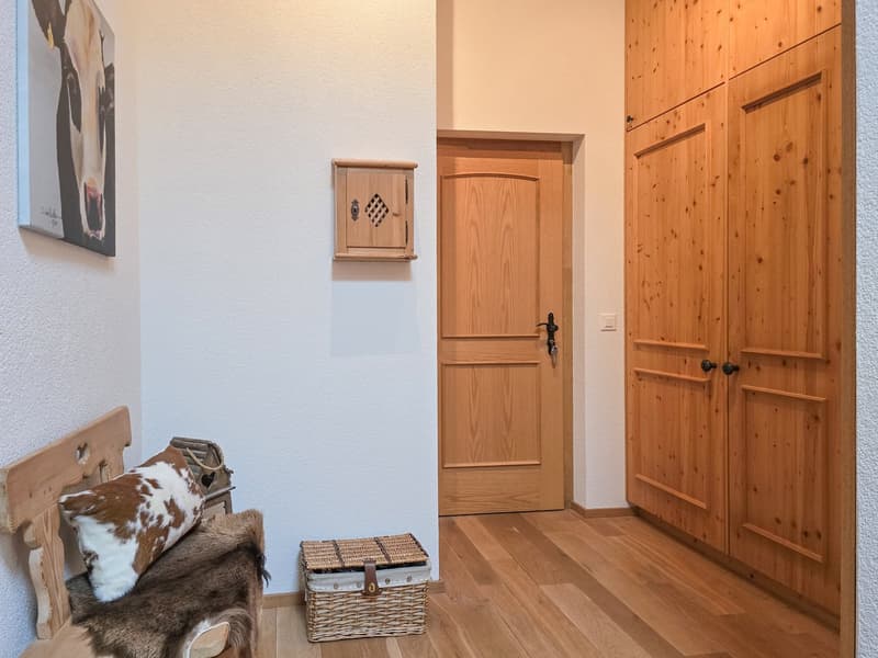 wooden bench with fur pillow, wooden storage box, wooden doors, wooden wall, painting