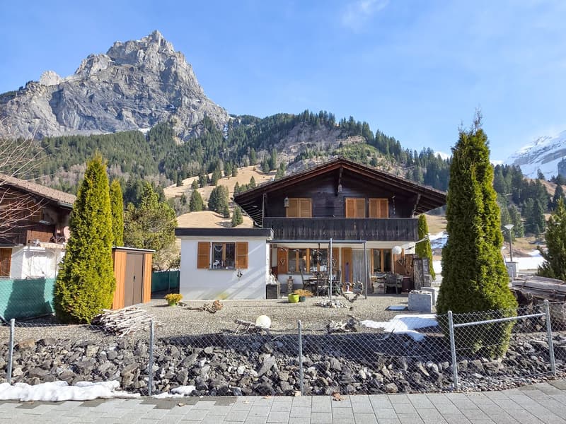Mountain house, wooden exterior, white interior, balcony, garden, mountain view