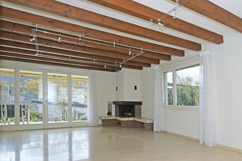 wooden ceiling, fireplace, large windows, wooden floor, white walls, white curtains