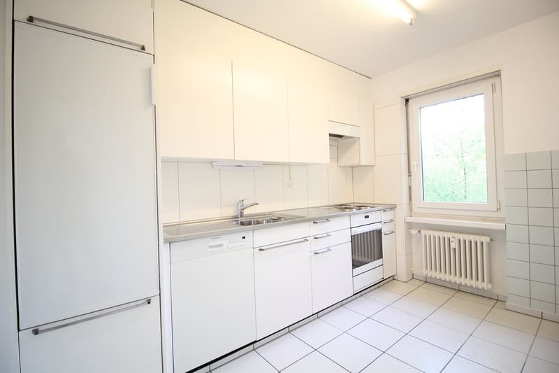 modern kitchen with white cabinets, stainless steel sink, dishwasher, electric oven, refrigerator, tiled floor