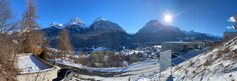 House in snowy mountain valley, snowy roofs, village in background, mountains in distance
