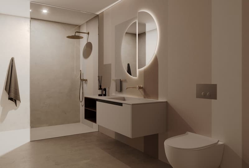 modern bathroom with white walls, white sink, round mirror, shower, toilet, towel rack, and a towel