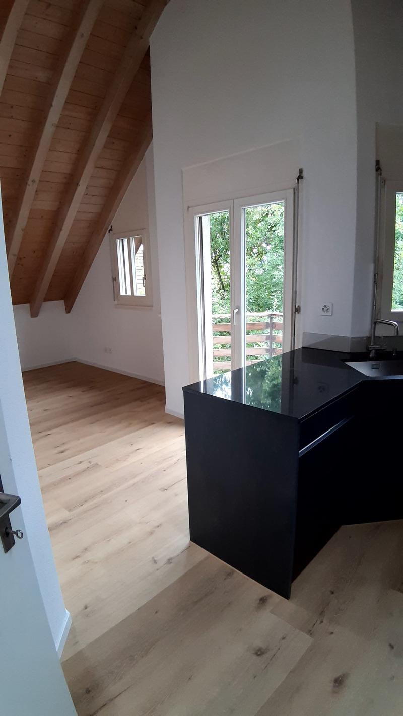 kitchen with island, wooden floor, glass doors, wooden ceiling
