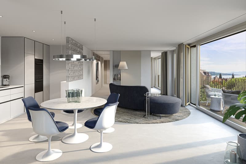 modern and clean design, round marble table, round cushioned ottoman, sectional sofa, glass railing, sliding glass doors, large windows, glass floor lamp, kitchen with stove and cabinet