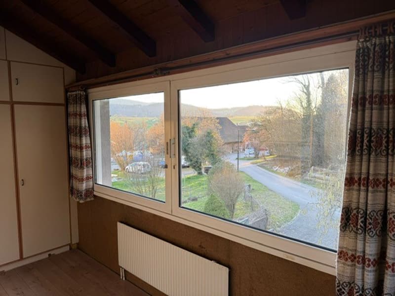 wooden floor, radiator, window, curtains, white cabinet
