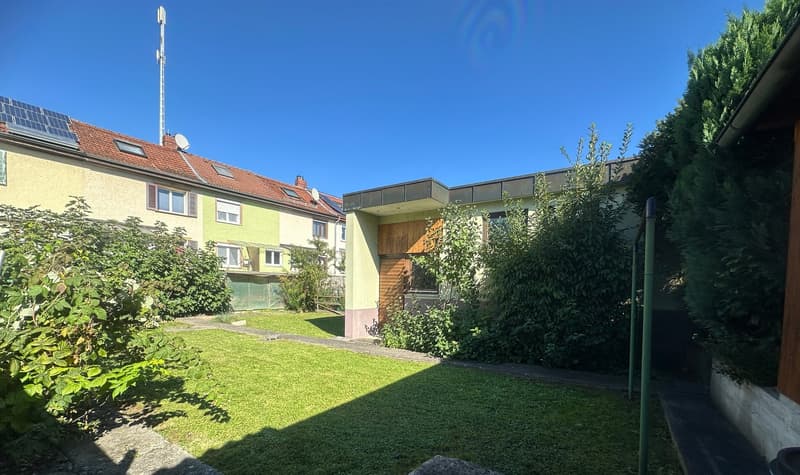 2 story houses, red roof, windows, grassy garden
