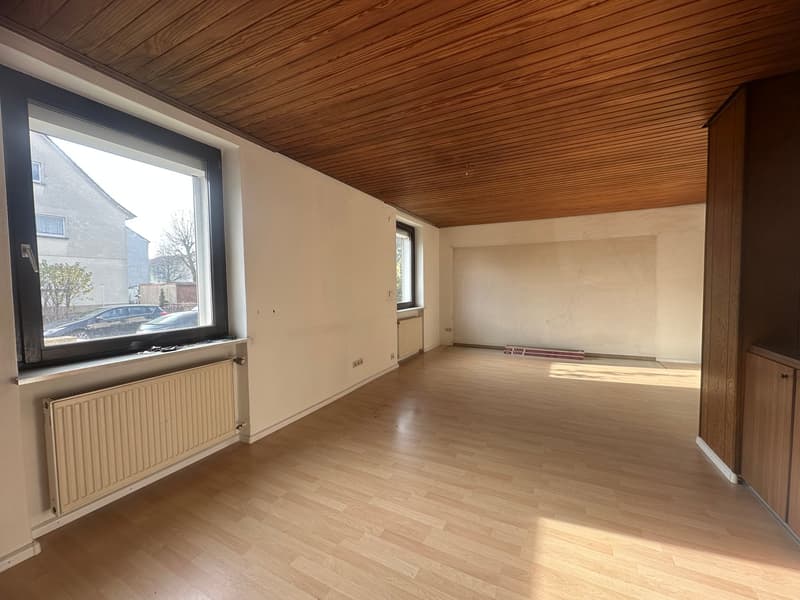 empty room, wooden floors, wooden ceiling, large windows, central heating