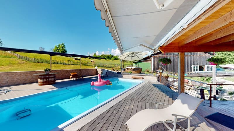 swimming pool, white lounge chair, blue rug, umbrella, wooden deck, fence