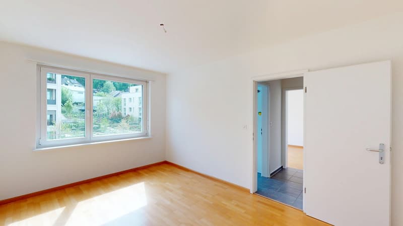empty room, wooden floor, white walls, large window, open door