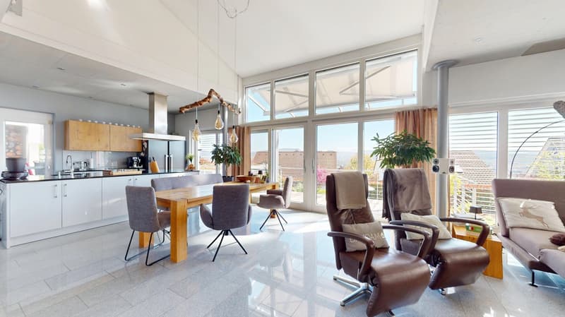 Open plan living room and kitchen, large windows, balcony, dining table, modern furniture, kitchen appliances