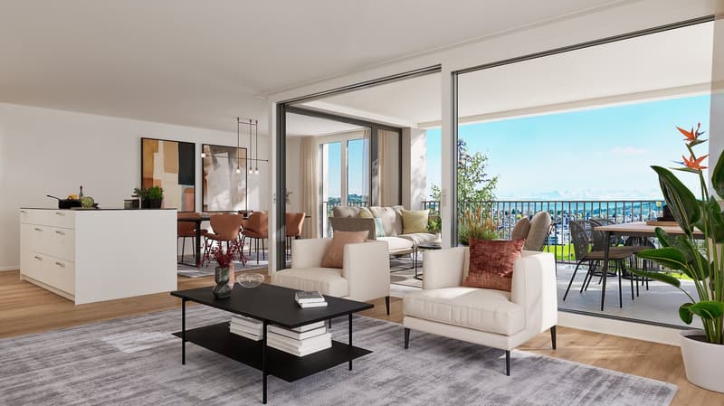 Spacious open-plan living area with large windows and sliding glass doors leading to a balcony with a scenic view. The room features a modern living room setup with a white sofa, armchair, and a black coffee table. The dining area is visible in the backgr