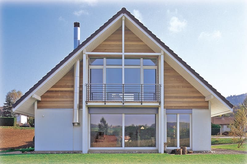 Detached house, sloping roof, modern style, wooden siding, large windows, balcony with railing, white walls