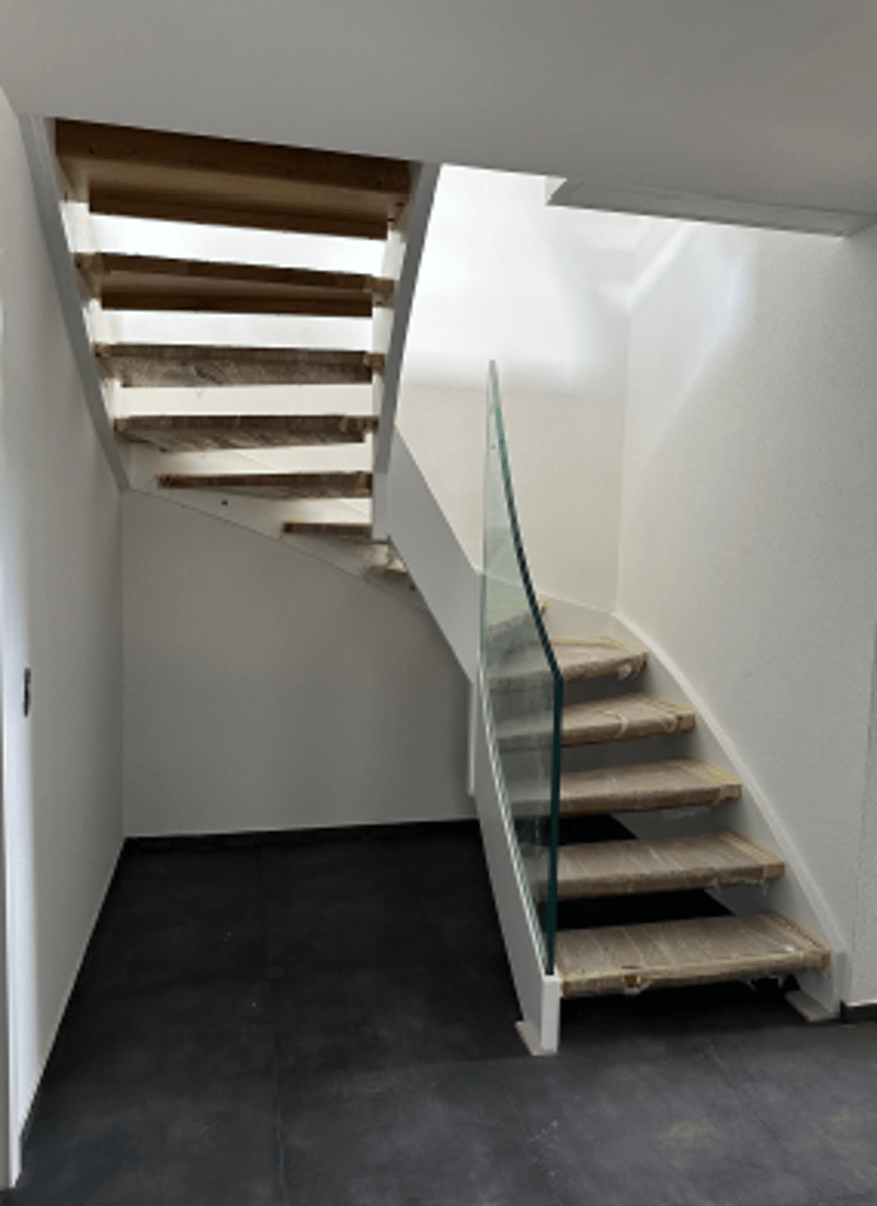 Staircase made of wood with glass railings