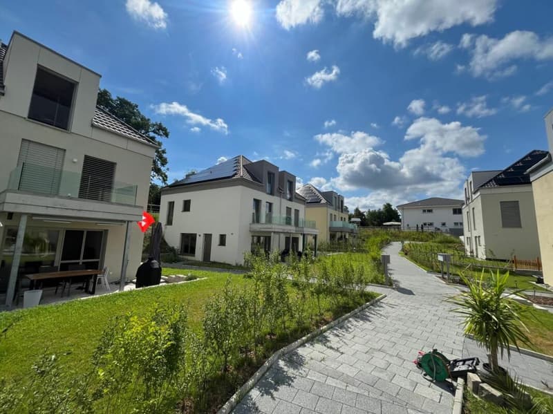 Casa a schiera nuova (F1) con 2 celle umide, 2 posti auto, giardino e area di seduta (1)