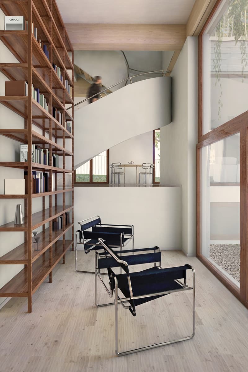 Open room, wooden floor, bookshelf, chairs, spiral staircase, dining table